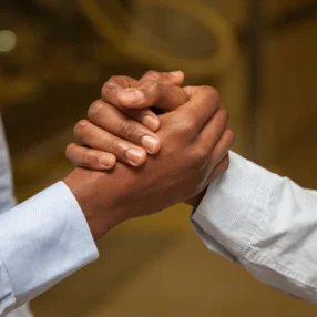 businessmen-shake-hands-600nw-679739206